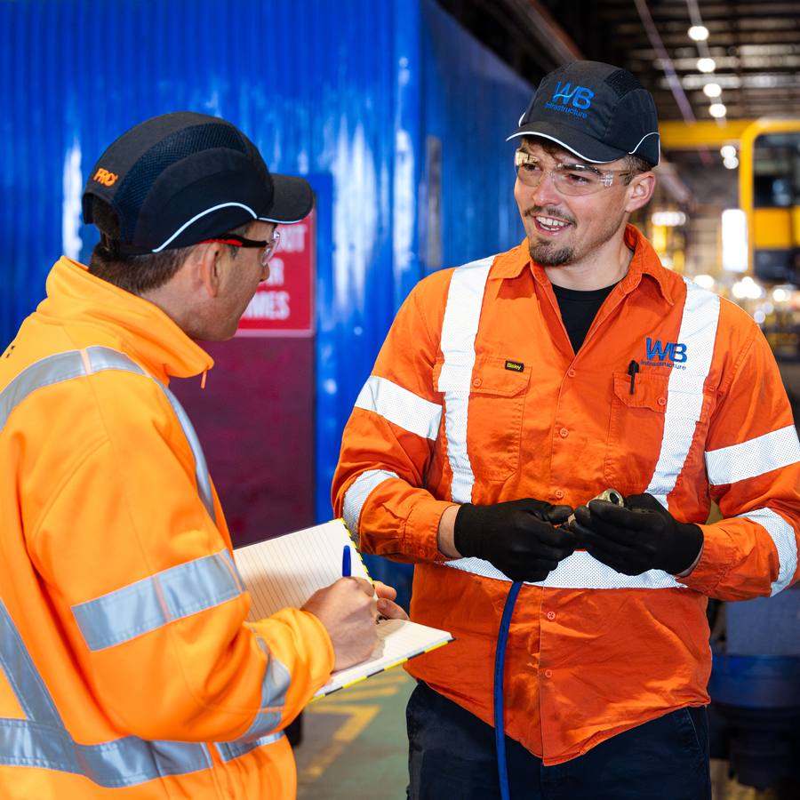 Two WB crew in a rail maintenance depot.