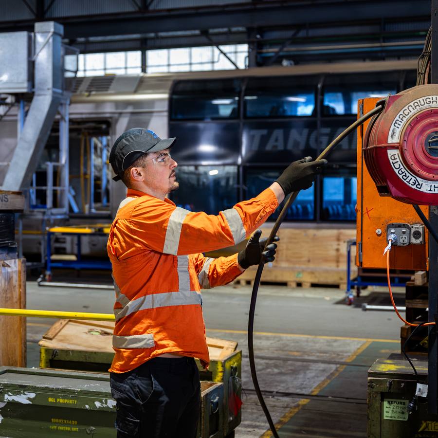A WB technician in a rail maintenance depot.