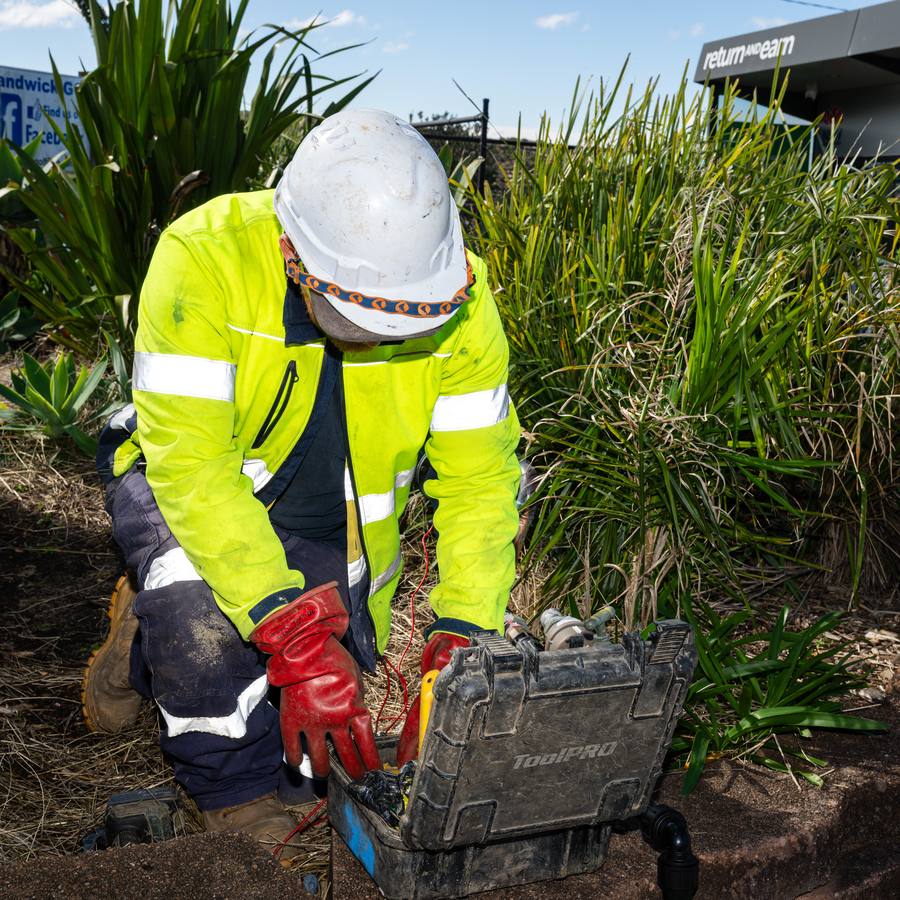 A WB technician working on a service pit.